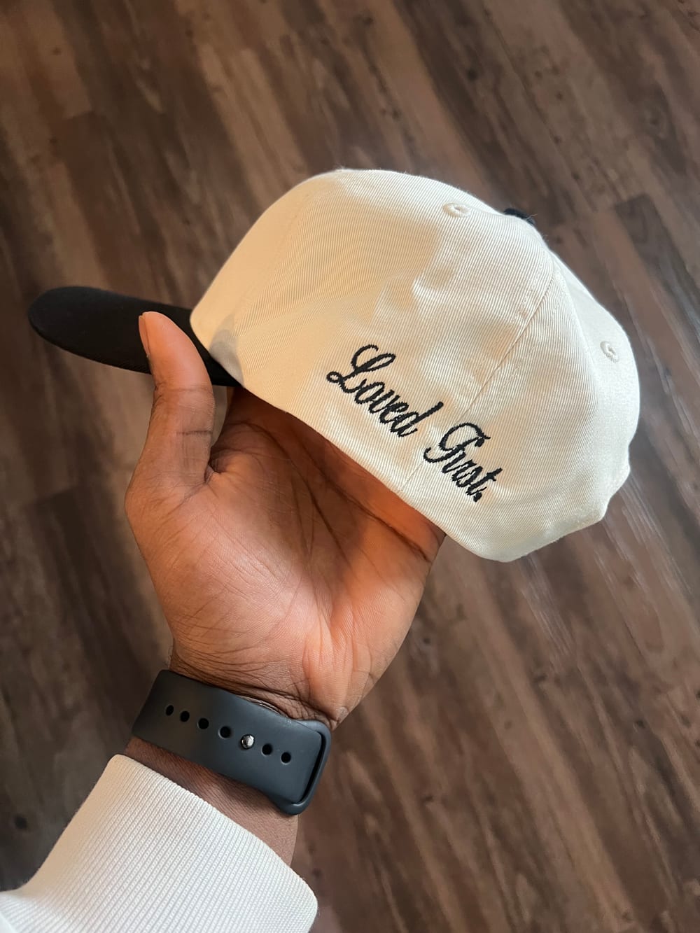 Back of a Grace N Grind hat embroidered with Loved First
